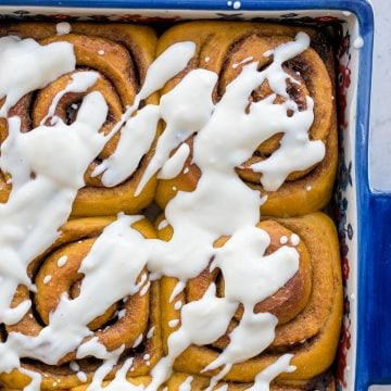 Soft and fluffy, pumpkin cinnamon rolls are packed with pumpkin, layered with pumpkin spice, and topped with cream cheese icing. Best fall treat ever. | aheadofthyme.com