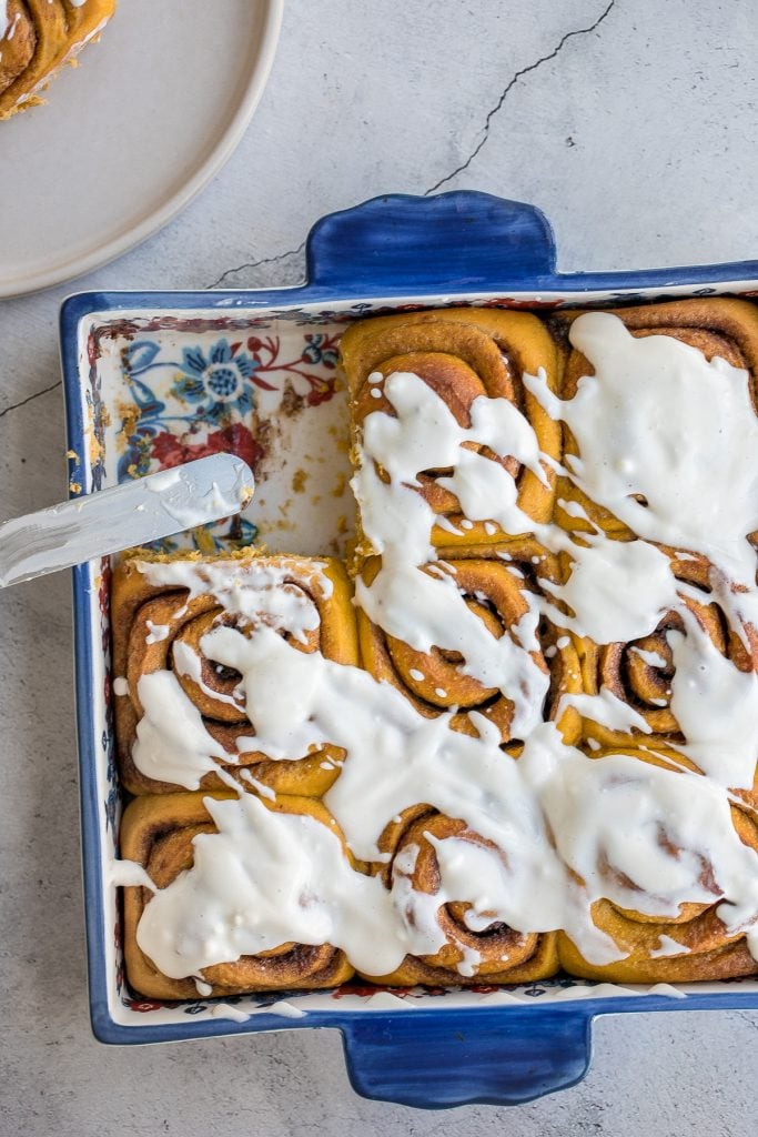 Soft and fluffy, pumpkin cinnamon rolls are packed with pumpkin, layered with pumpkin spice, and topped with cream cheese icing. Best fall treat ever. | aheadofthyme.com