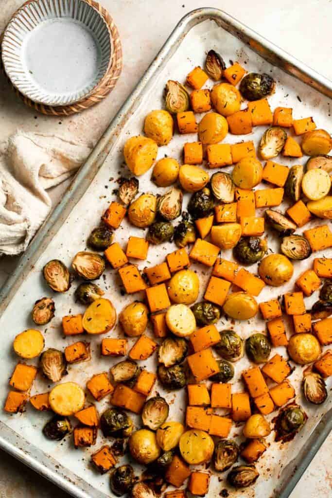 One pan roasted fall vegetables with seasonal produce is a cozy, stress-free side dish that’s perfect for Thanksgiving, holidays, or autumn dinners. | aheadofthyme.com