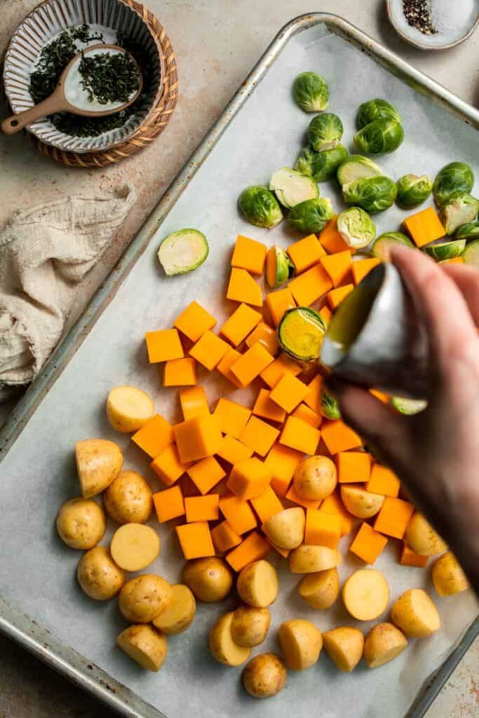 One pan roasted fall vegetables with seasonal produce is a cozy, stress-free side dish that’s perfect for Thanksgiving, holidays, or autumn dinners. | aheadofthyme.com