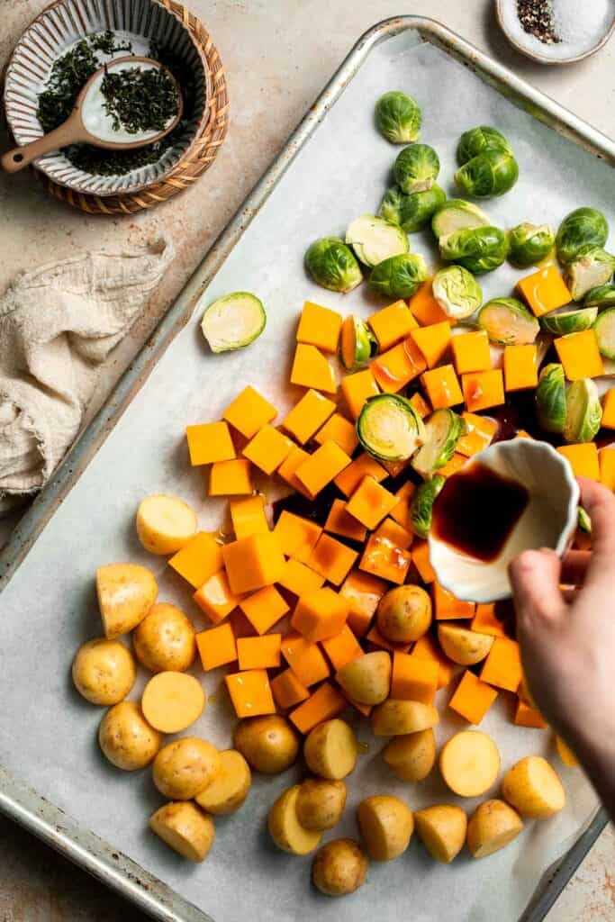 One pan roasted fall vegetables with seasonal produce is a cozy, stress-free side dish that’s perfect for Thanksgiving, holidays, or autumn dinners. | aheadofthyme.com