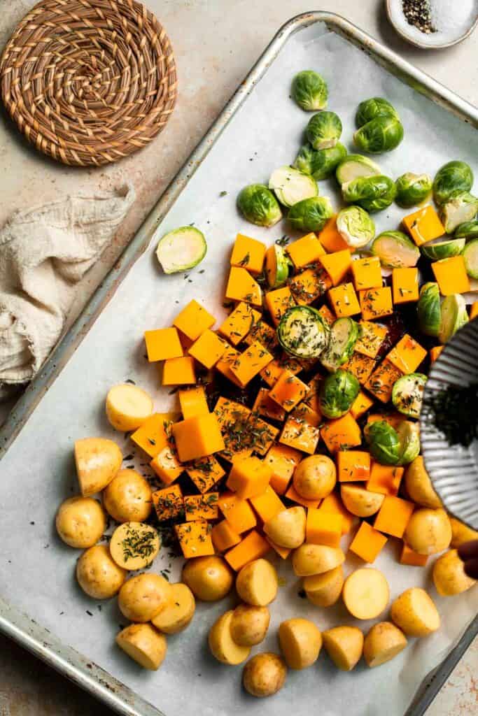 One pan roasted fall vegetables with seasonal produce is a cozy, stress-free side dish that’s perfect for Thanksgiving, holidays, or autumn dinners. | aheadofthyme.com