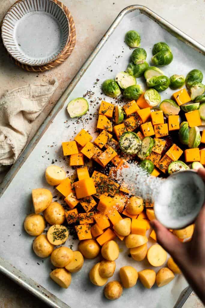 One pan roasted fall vegetables with seasonal produce is a cozy, stress-free side dish that’s perfect for Thanksgiving, holidays, or autumn dinners. | aheadofthyme.com
