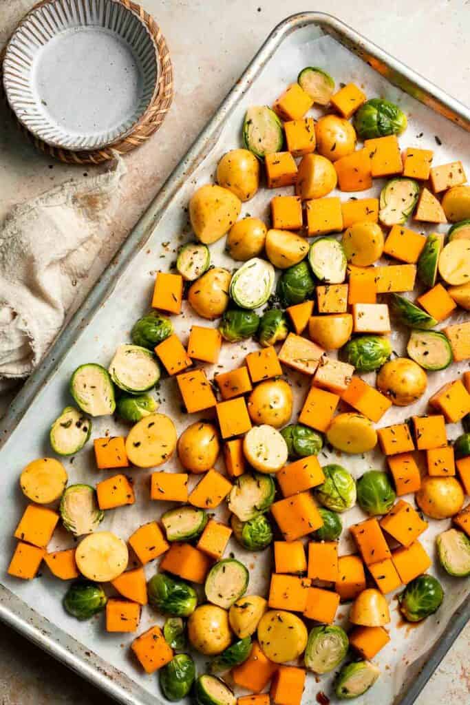One pan roasted fall vegetables with seasonal produce is a cozy, stress-free side dish that’s perfect for Thanksgiving, holidays, or autumn dinners. | aheadofthyme.com