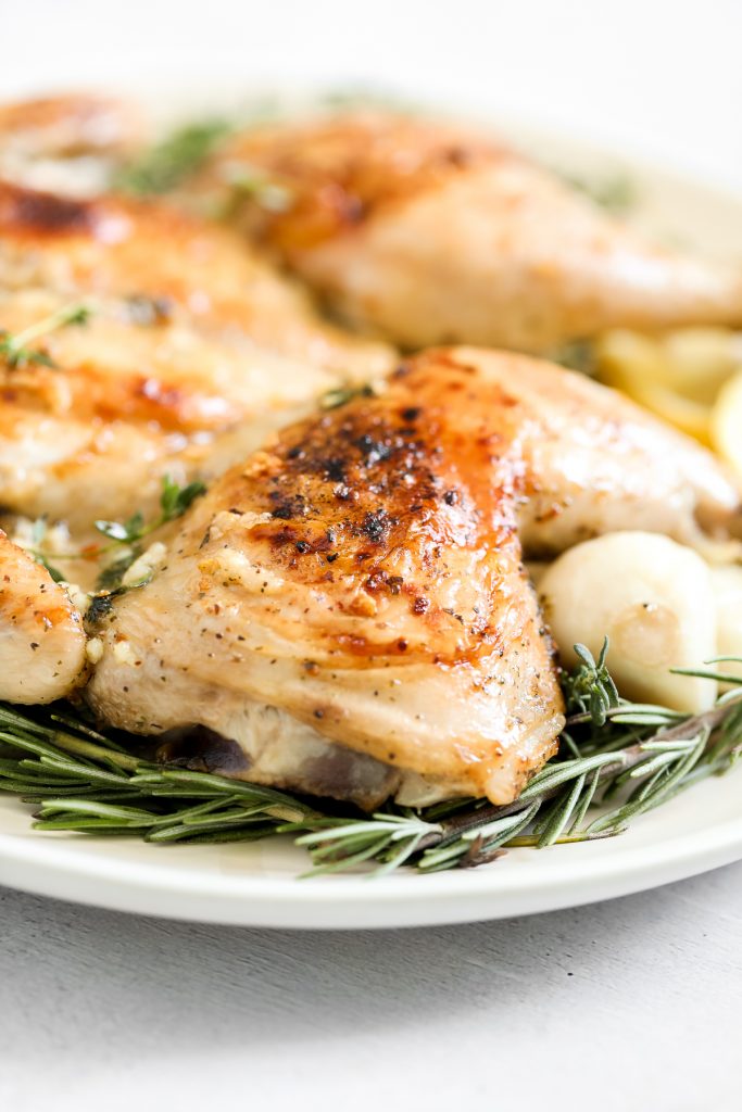 Quick and easy roasted spatchcock chicken (butterflied chicken) seasoned with garlic and thyme is juicy, tender, delicious and flavourful with minimal prep. | aheadofthyme.com