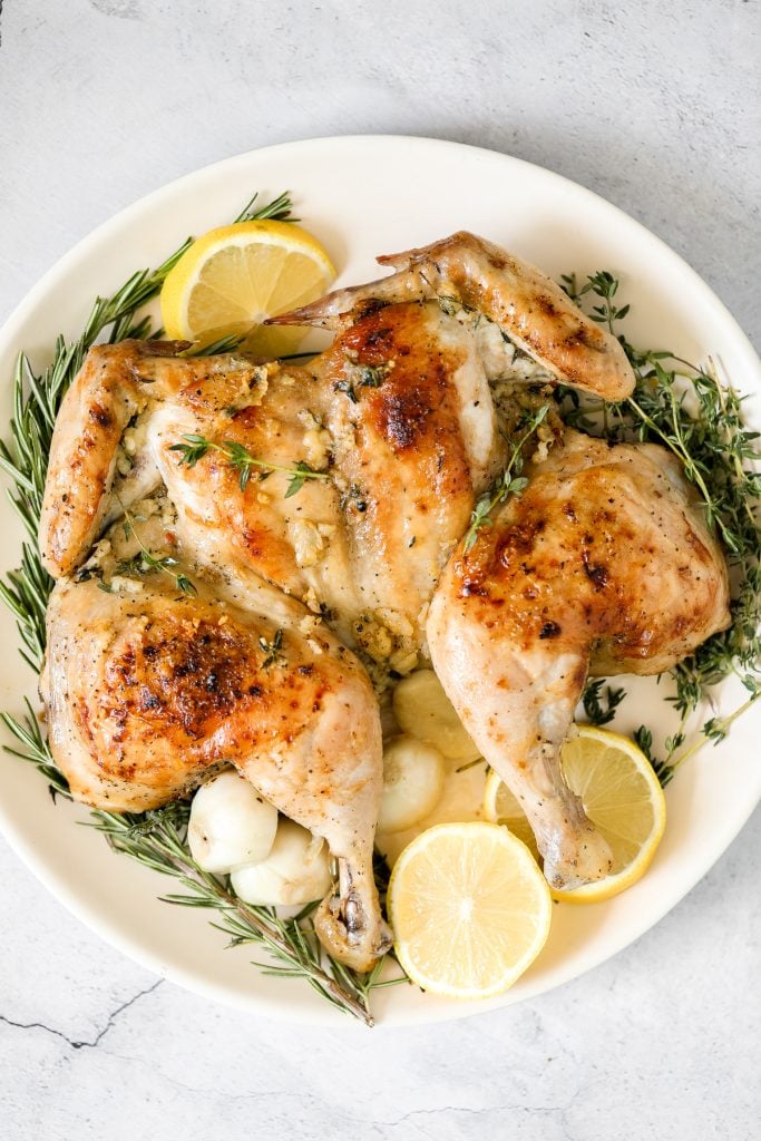 Quick and easy roasted spatchcock chicken (butterflied chicken) seasoned with garlic and thyme is juicy, tender, delicious and flavourful with minimal prep. | aheadofthyme.com