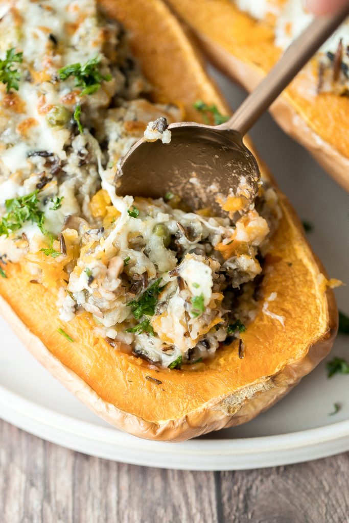 Healthy hearty and wholesome stuffed butternut squash with wild rice and mushrooms is an easy cozy vegetarian fall dinner or side. The best comfort food. | aheadofthyme.com