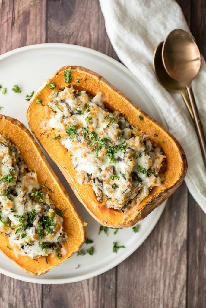 Healthy hearty and wholesome stuffed butternut squash with wild rice and mushrooms is an easy cozy vegetarian fall dinner or side. The best comfort food. | aheadofthyme.com