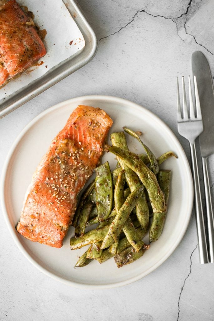 Quick and easy baked maple salmon is so delicious, flaky and flavourful with the perfect balance between sweet and savoury. The best weeknight dinner. | aheadofthyme.com