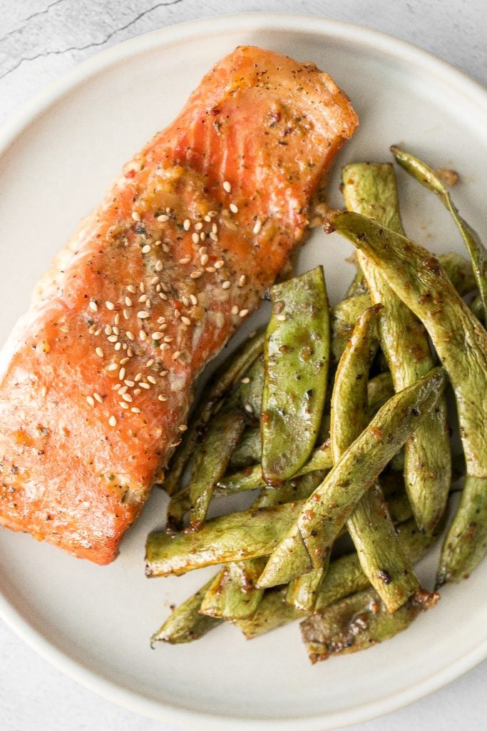 Quick and easy baked maple salmon is so delicious, flaky and flavourful with the perfect balance between sweet and savoury. The best weeknight dinner. | aheadofthyme.com