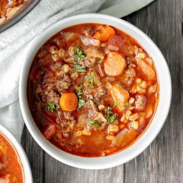 Hearty beef cabbage barley soup is wholesome, filling and flavourful. This one pot meal can be made ahead and is freezer-friendly. Prep it in 10 minutes. | aheadofthyme.com