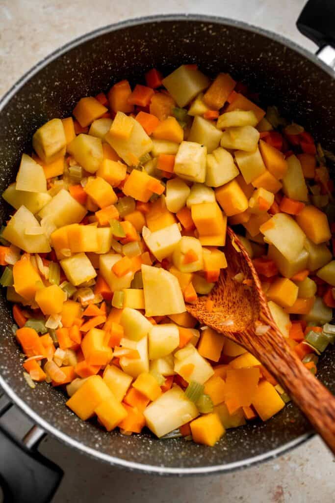 Butternut Squash Apple Soup is healthy and simple yet packed with so much flavour. Top this easy vegan soup with a layer of homemade toasted croutons. | aheadofthyme.com