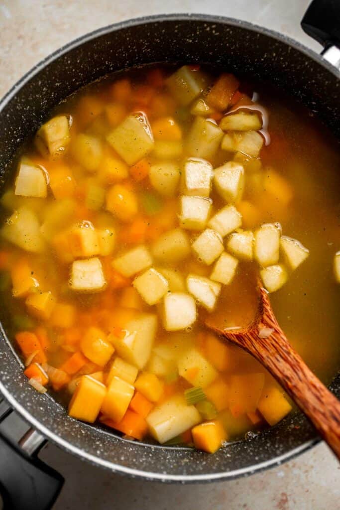 Butternut Squash Apple Soup is healthy and simple yet packed with so much flavour. Top this easy vegan soup with a layer of homemade toasted croutons. | aheadofthyme.com