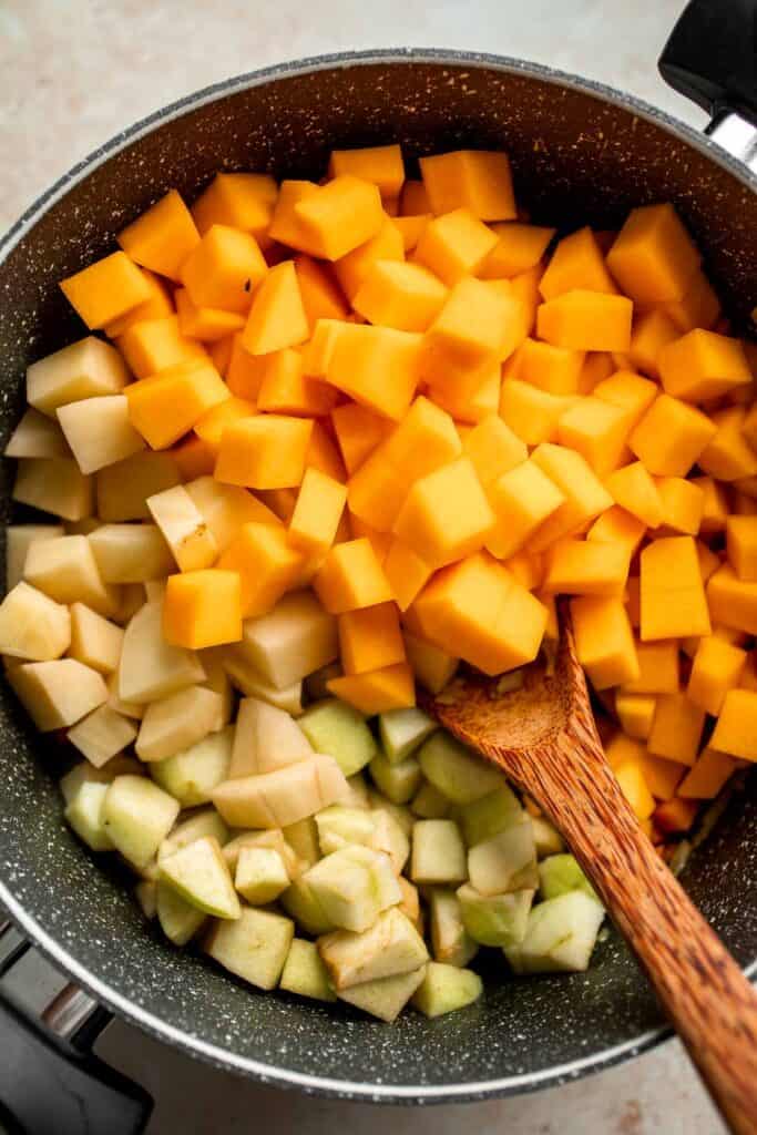 Butternut Squash Apple Soup is healthy and simple yet packed with so much flavour. Top this easy vegan soup with a layer of homemade toasted croutons. | aheadofthyme.com