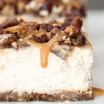 Decadent caramel pecan pie cheesecake bars with a graham cracker crust, cheesecake filling, and caramel pecan topping is perfect for Thanksgiving this fall. | aheadofthyme.com