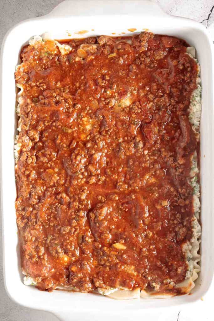 Easy Meat Lasagna is a classic, hearty, homemade pasta dish layered with beef sauce, ricotta, mozzarella, and parmesan — perfect for cozy family dinners. | aheadofthyme.com