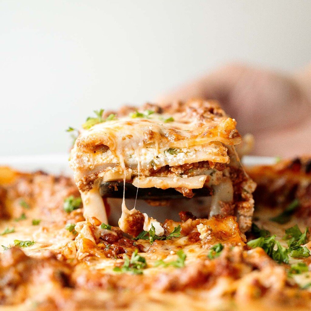 Easy Meat Lasagna is a classic, hearty, homemade pasta dish layered with beef sauce, ricotta, mozzarella, and parmesan — perfect for cozy family dinners. | aheadofthyme.com
