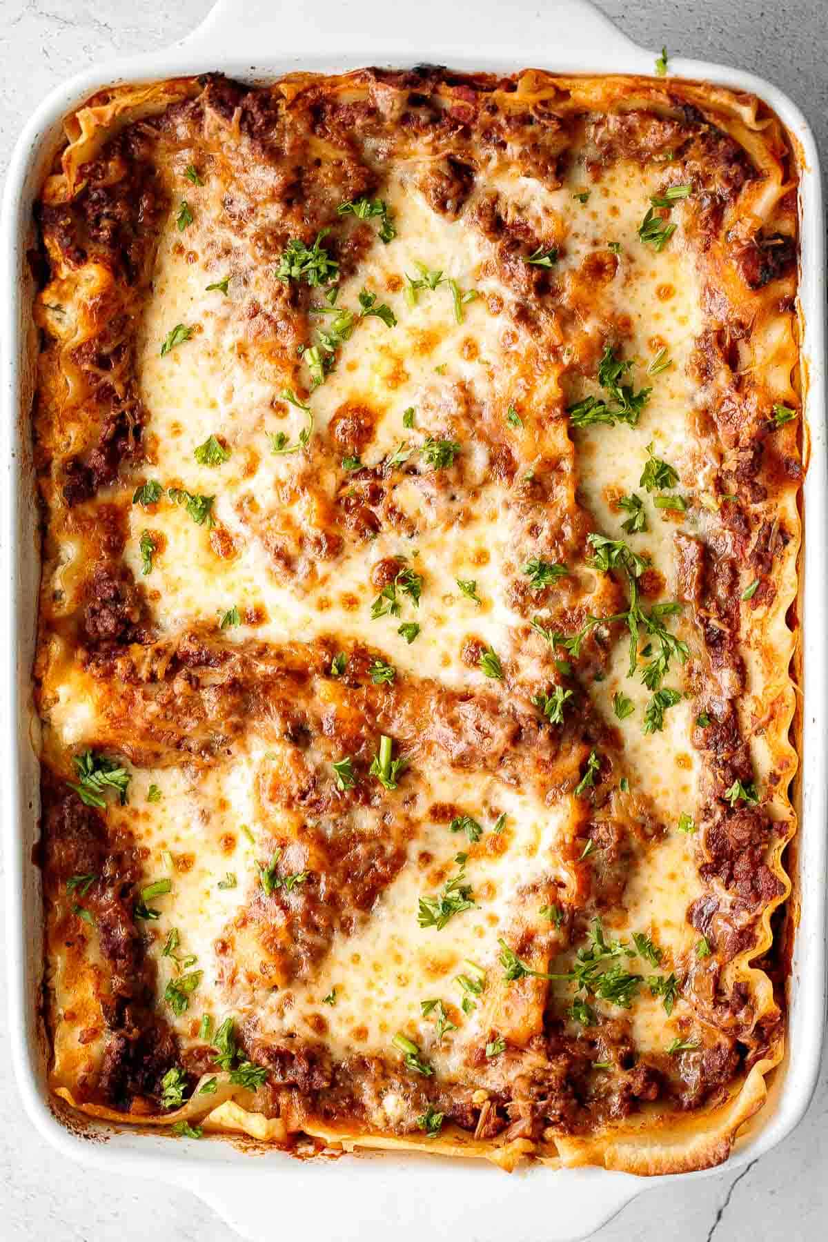 Easy Meat Lasagna is a classic, hearty, homemade pasta dish layered with beef sauce, ricotta, mozzarella, and parmesan — perfect for cozy family dinners. | aheadofthyme.com