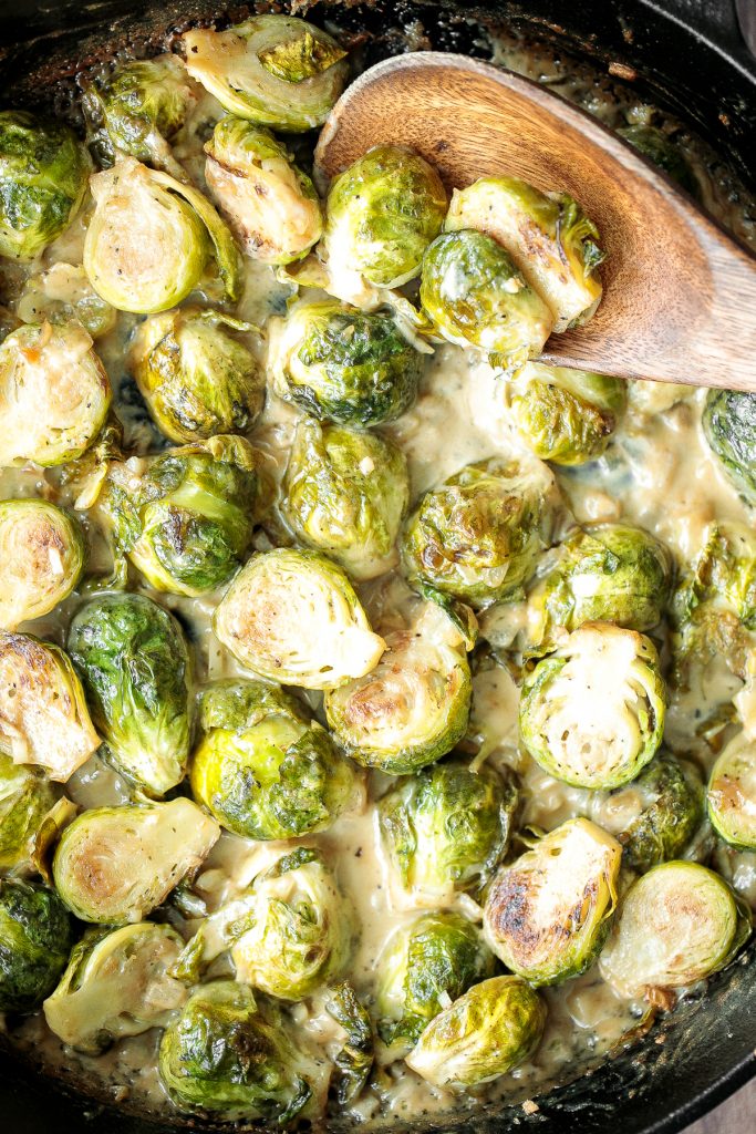 Delicious, garlicky, cheesy and creamy brussels sprouts bake is the ultimate comfort food side dish. So flavourful and the best way to eat brussels sprouts. | aheadofthyme.com