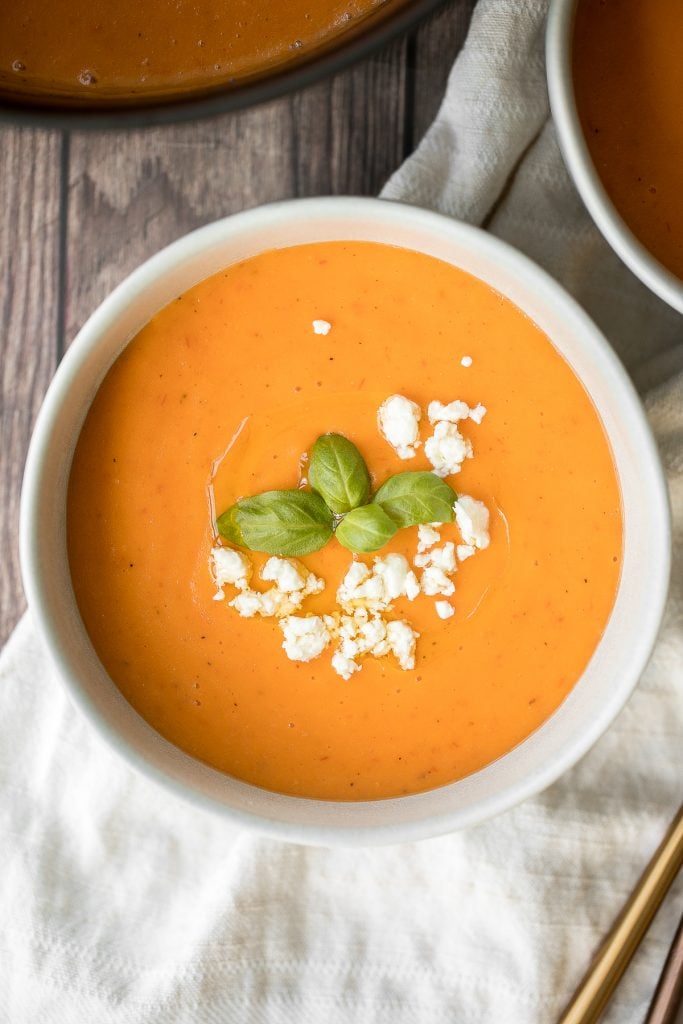 Make this silky smooth and creamy tomato potato soup in under 25 minutes. This gluten-free vegan soup is healthy and filling and the easiest weeknight meal. | aheadofthyme.com