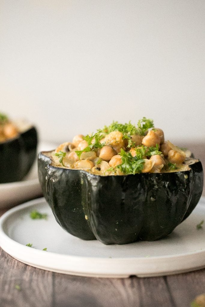 Wholesome, hearty, curried chickpea stuffed acorn squash with curry flavours is the perfect vegan and gluten-free fall comfort food for your holiday dinner. | aheadofthyme.com