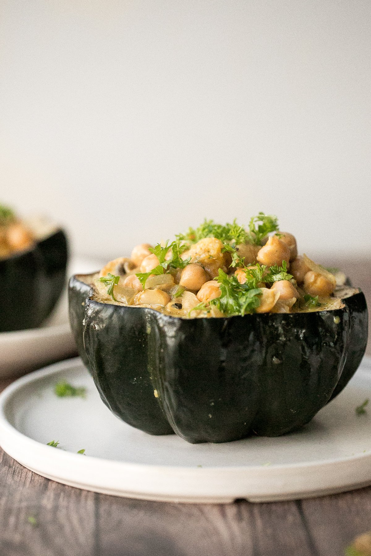 Wholesome, hearty, curried chickpea stuffed acorn squash with curry flavours is the perfect vegan and gluten-free fall comfort food for your holiday dinner. | aheadofthyme.com