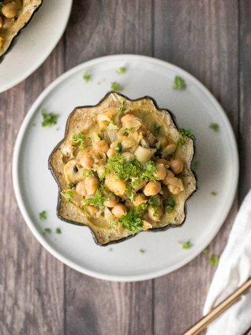 Wholesome, hearty, curried chickpea stuffed acorn squash with curry flavours is the perfect vegan and gluten-free fall comfort food for your holiday dinner. | aheadofthyme.com