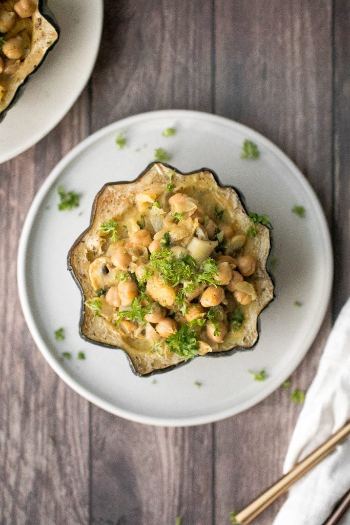 Wholesome, hearty, curried chickpea stuffed acorn squash with curry flavours is the perfect vegan and gluten-free fall comfort food for your holiday dinner. | aheadofthyme.com