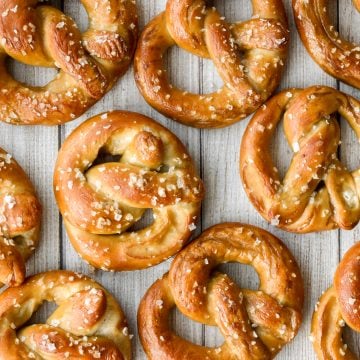 The best quick and easy salted soft pretzels are buttery, salty, and so delicious. They are golden brown and chewy on the outside, yet warm and soft inside. | aheadofthyme.com