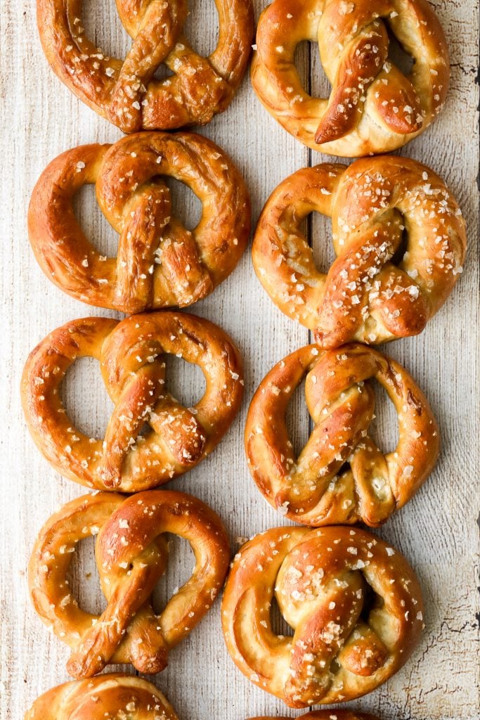 The best quick and easy salted soft pretzels are buttery, salty, and so delicious. They are golden brown and chewy on the outside, yet warm and soft inside. | aheadofthyme.com