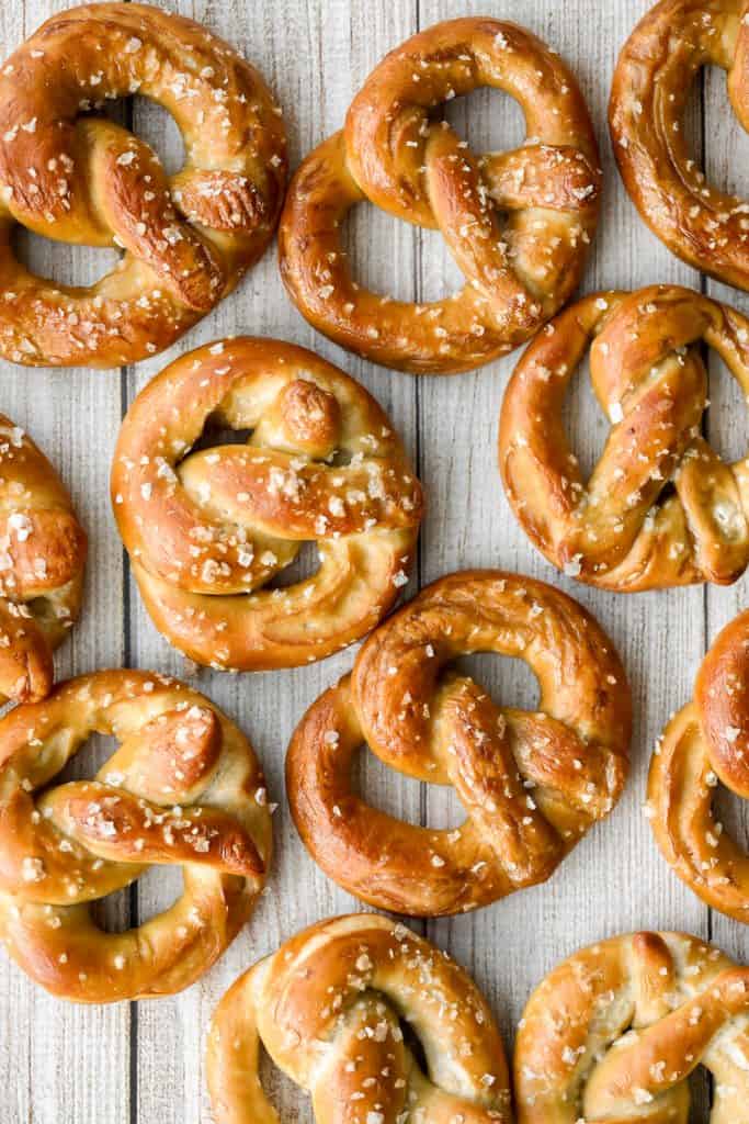 The best quick and easy salted soft pretzels are buttery, salty, and so delicious. They are golden brown and chewy on the outside, yet warm and soft inside. | aheadofthyme.com