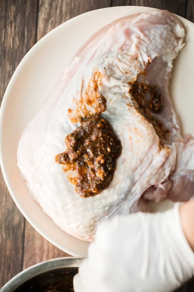 Juicy slow cooker turkey breast with crispy skin, garlic, and fresh herbs. An easy crockpot recipe for tender, flavorful turkey every time. | aheadofthyme.com