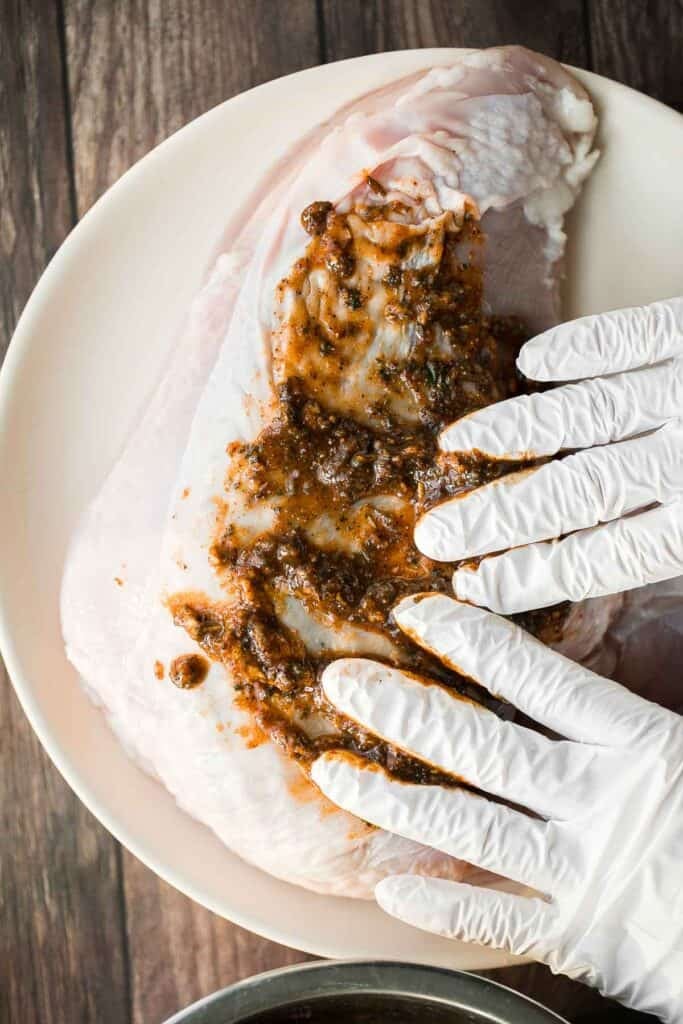 Juicy slow cooker turkey breast with crispy skin, garlic, and fresh herbs. An easy crockpot recipe for tender, flavorful turkey every time. | aheadofthyme.com