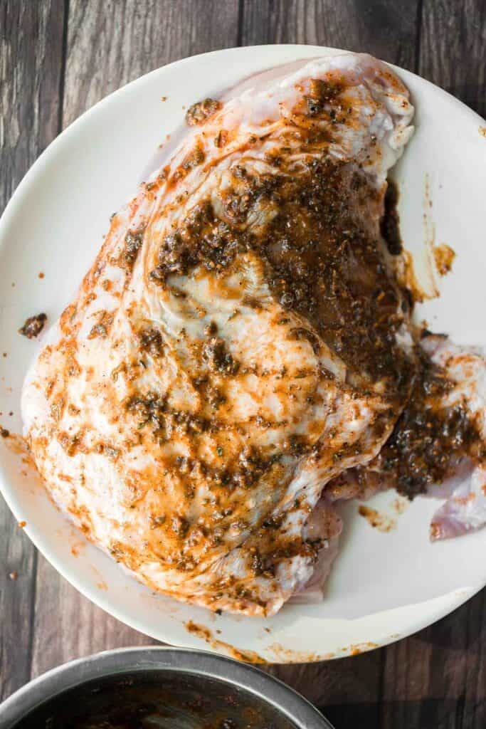 Juicy slow cooker turkey breast with crispy skin, garlic, and fresh herbs. An easy crockpot recipe for tender, flavorful turkey every time. | aheadofthyme.com
