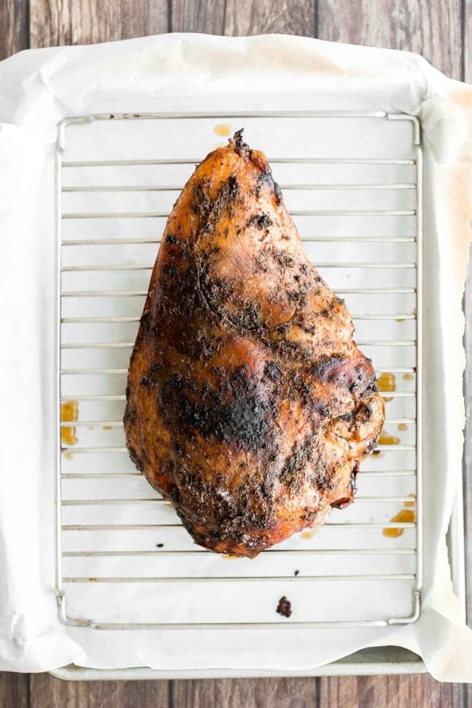 Juicy slow cooker turkey breast with crispy skin, garlic, and fresh herbs. An easy crockpot recipe for tender, flavorful turkey every time. | aheadofthyme.com