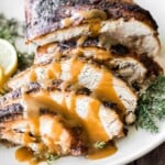 Juicy slow cooker turkey breast with crispy skin, garlic, and fresh herbs. An easy crockpot recipe for tender, flavorful turkey every time. | aheadofthyme.com