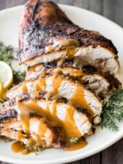 Juicy slow cooker turkey breast with crispy skin, garlic, and fresh herbs. An easy crockpot recipe for tender, flavorful turkey every time. | aheadofthyme.com