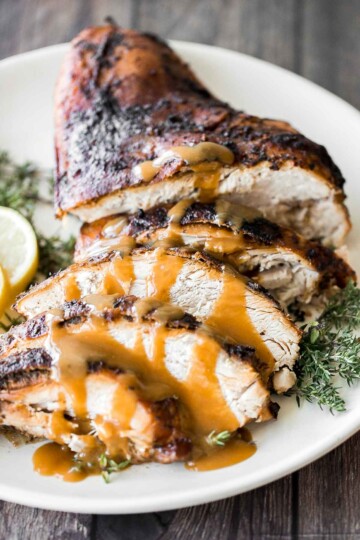 Juicy slow cooker turkey breast with crispy skin, garlic, and fresh herbs. An easy crockpot recipe for tender, flavorful turkey every time. | aheadofthyme.com