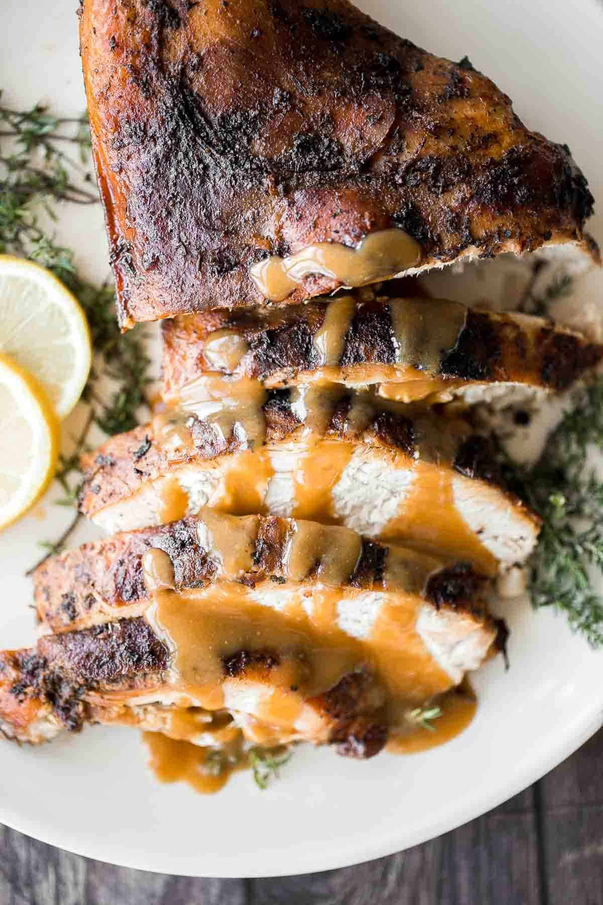 Juicy slow cooker turkey breast with crispy skin, garlic, and fresh herbs. An easy crockpot recipe for tender, flavorful turkey every time. | aheadofthyme.com
