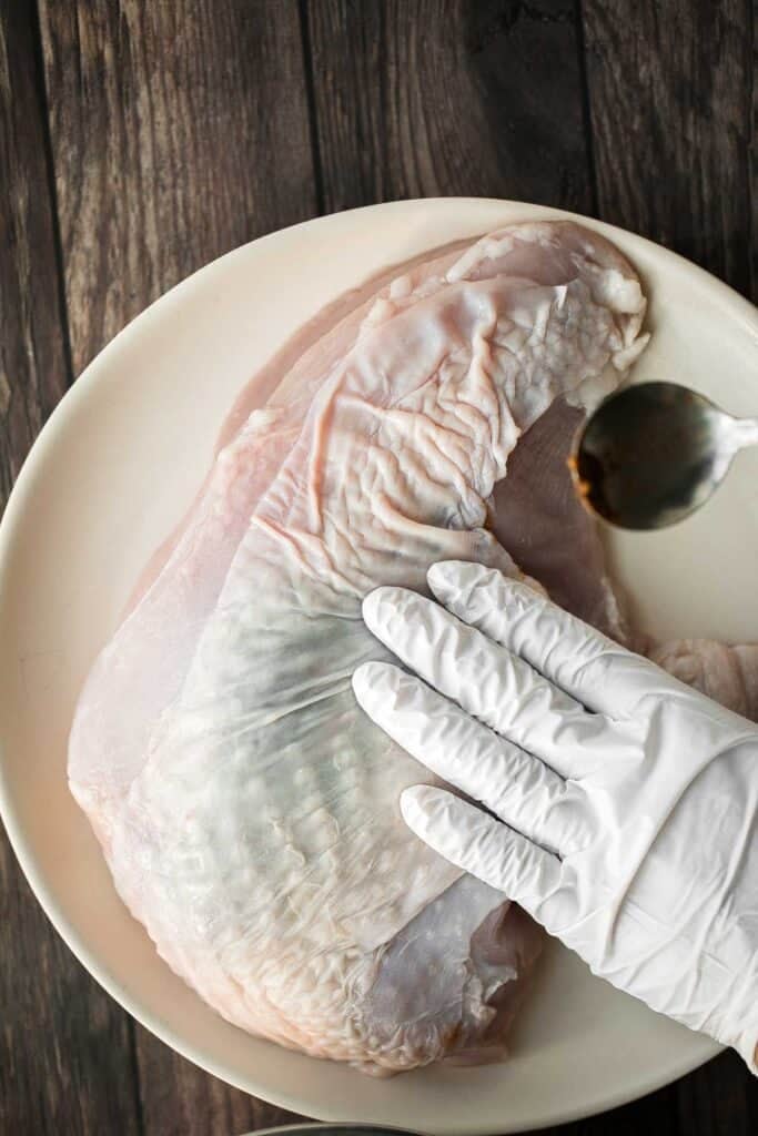 Juicy slow cooker turkey breast with crispy skin, garlic, and fresh herbs. An easy crockpot recipe for tender, flavorful turkey every time. | aheadofthyme.com