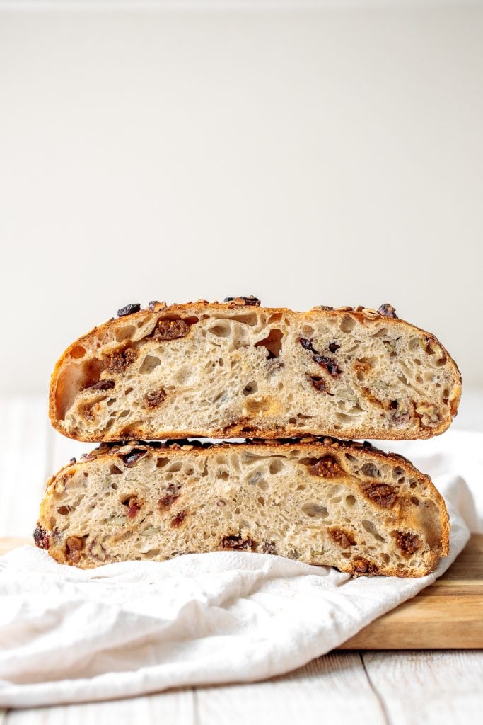 Fruit and nut sourdough bread is chewy and airy with a crunchy crackly crust is so delicious, packed with dried figs, raisins, walnuts, and seeds. | aheadofthyme.com