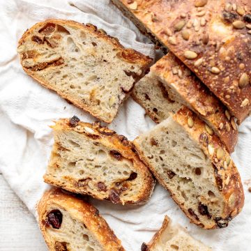 Fruit and nut sourdough bread is chewy and airy with a crunchy crackly crust is so delicious, packed with dried figs, raisins, walnuts, and seeds. | aheadofthyme.com