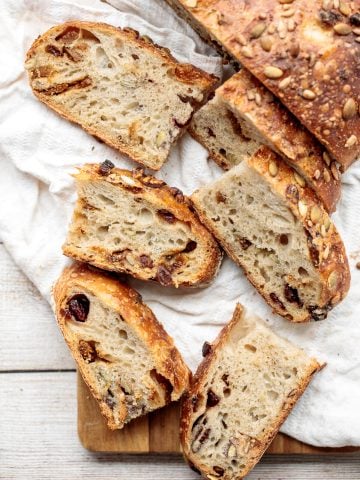 Fruit and nut sourdough bread is chewy and airy with a crunchy crackly crust is so delicious, packed with dried figs, raisins, walnuts, and seeds. | aheadofthyme.com