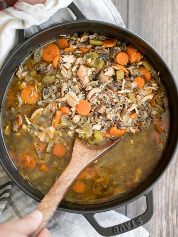 Wholesome hearty one pot leftover turkey wild rice soup is the most comforting way to use leftover turkey from Thanksgiving turkey dinner. So easy to make. | aheadofthyme.com