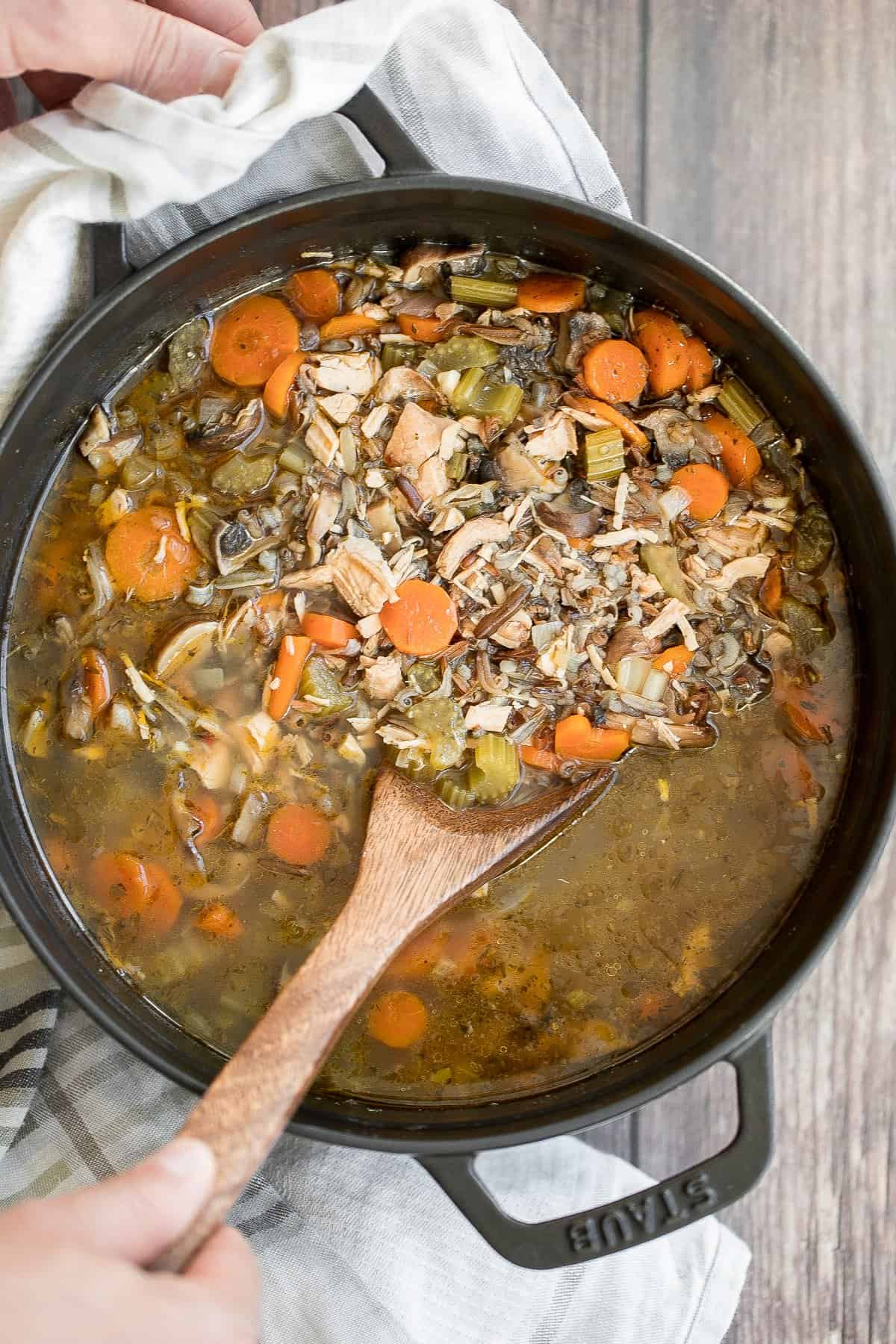 Wholesome hearty one pot leftover turkey wild rice soup is the most comforting way to use leftover turkey from Thanksgiving turkey dinner. So easy to make. | aheadofthyme.com