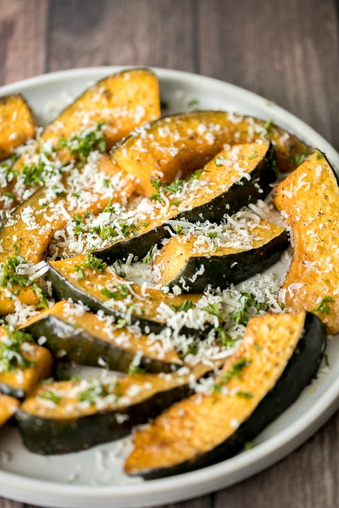 Soft and tender, easy roasted pumpkin wedges with Parmesan cheese is the easiest and most delicious side dishes to make this fall. Prep it in just minutes. | aheadofthyme.com