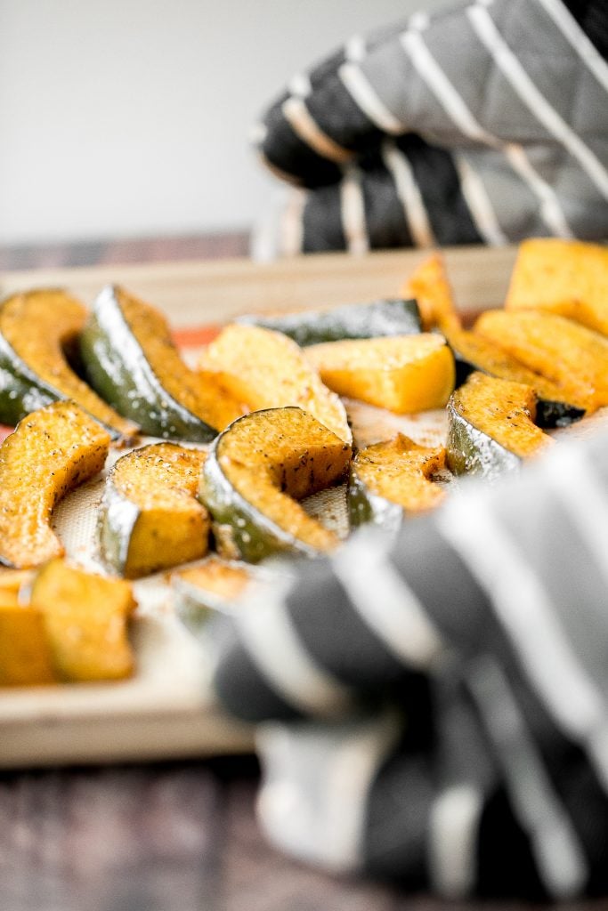 Soft and tender, easy roasted pumpkin wedges with Parmesan cheese is the easiest and most delicious side dishes to make this fall. Prep it in just minutes. | aheadofthyme.com