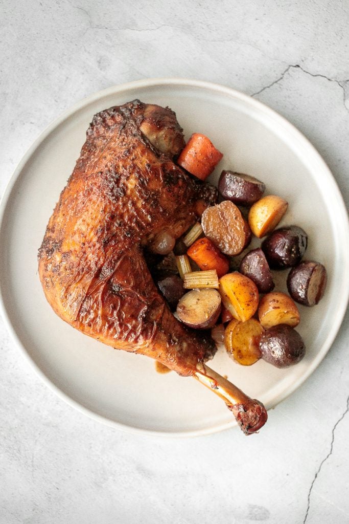 Tender, succulent and flavourful, easy roasted turkey legs with crispy skin and vegetables is a complete wholesome turkey dinner and family favourite. | aheadofthyme.com