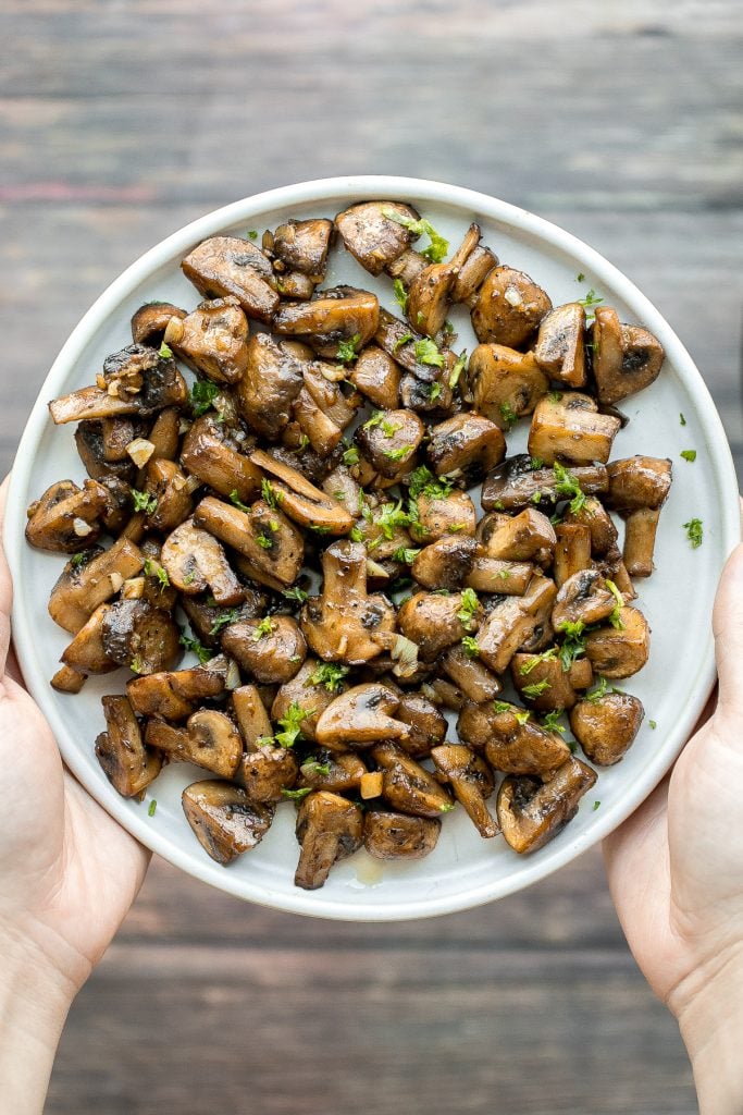 Buttery sautéed garlic mushrooms are silky smooth with an incredible caramelization and earthy rich flavour. A simple side dish in under 15 minutes. | aheadofthyme.com