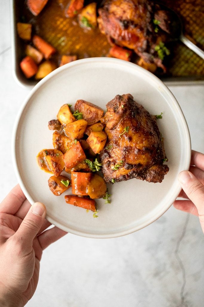 Sheet pan curry chicken and vegetables with tender chicken thighs marinated in a delicious flavourful curry marinade is a complete one pan dinner. | aheadofthyme.com